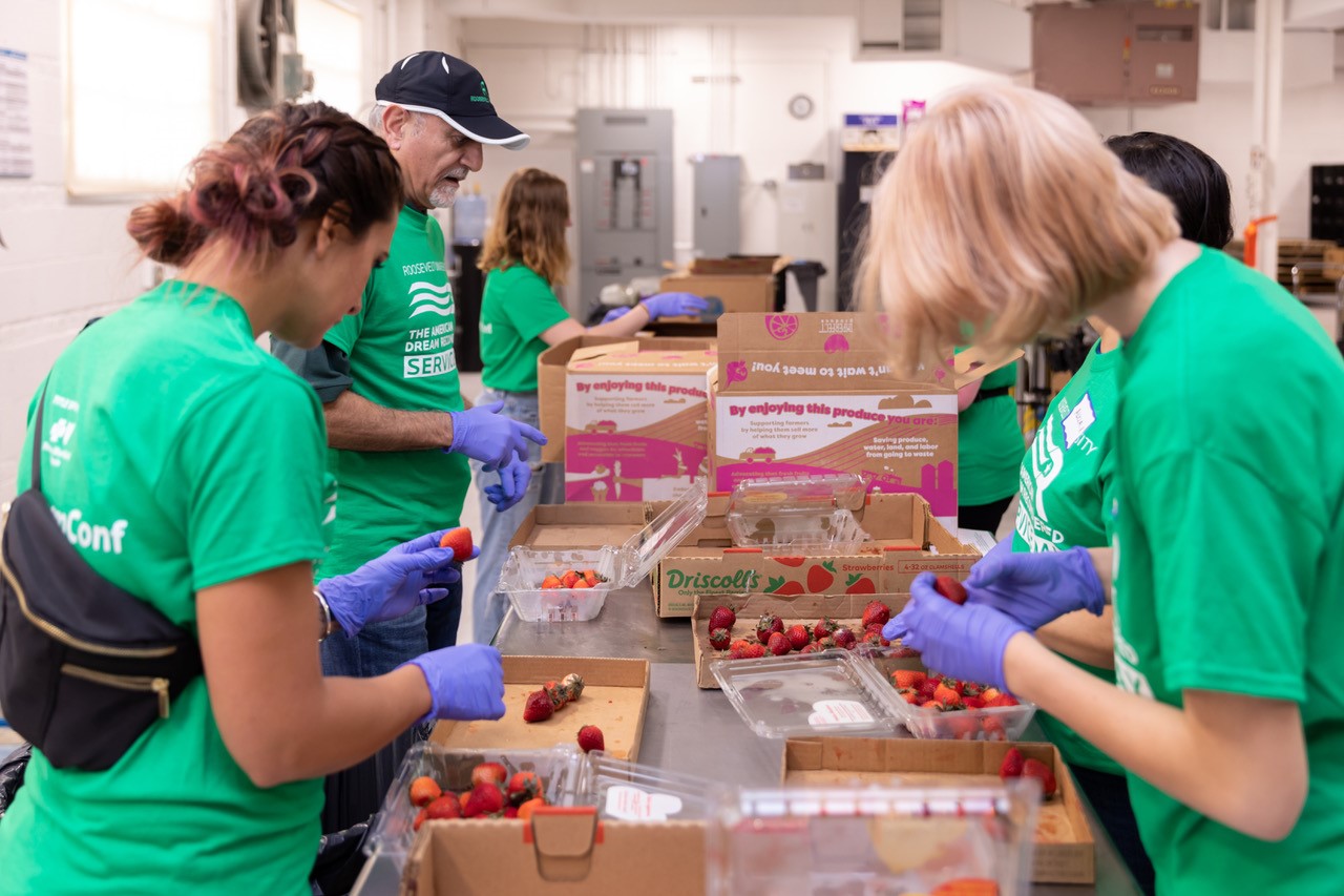 group packaging strawberries.